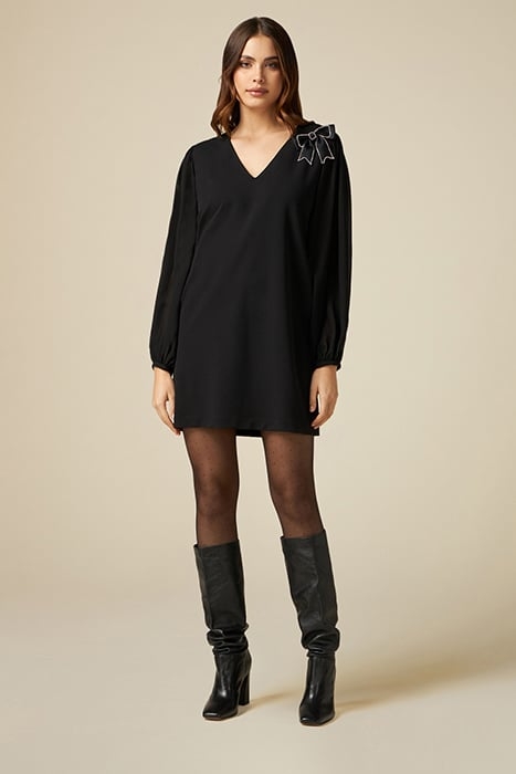 Dual-material dress with brooch 1